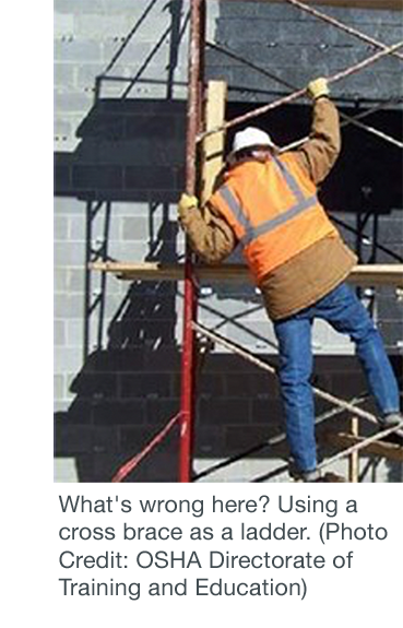 Worker unsafely using a cross brace as a ladder