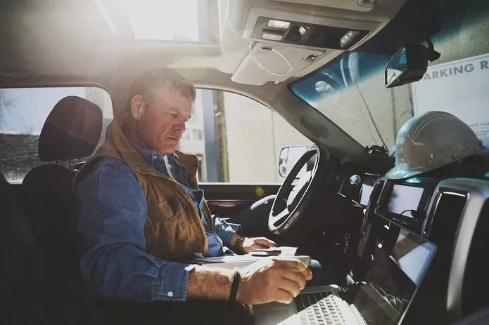 Construction Worker in Truck Cab