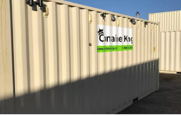 beige shipping container under blue sky