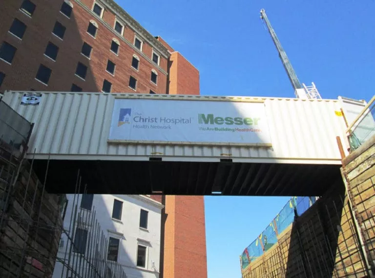 storage container being used as a temporary walkway on a construction site
