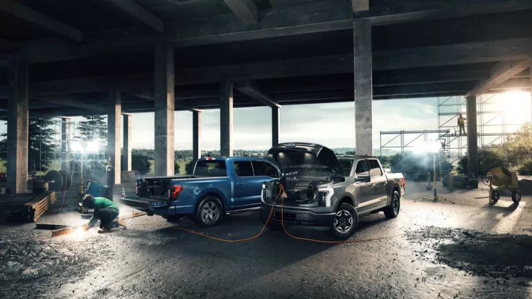 Ford Pro F-150 Lightning trucks near jobsite