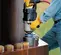 Silver and black Ingersoll Rand 1-1/2 inch drive Air Impact Wrench being used to remove very large bolts