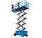 Front angled view of a partially extended blue Genie scissor lift with guardrails.