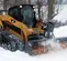 Gray and yellow PALADIN Snow Blower Attachment for Skid Steer
