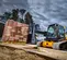 Yellow and black JCB 3,600 lb. Compact Track Loader with a Telescopic Boom