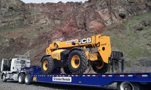 Forklift in front of the mountains