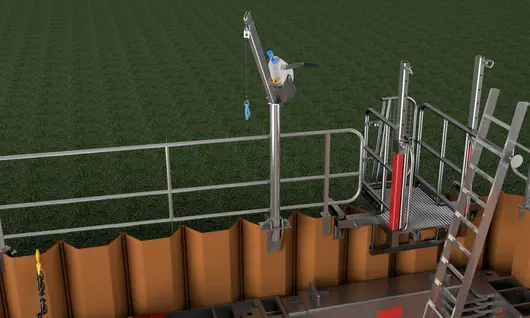 Construction worksite with scaffolding tubes and temporary fencing in place to ensure safety and secure the project area.