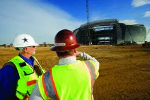 two men in hard hats on construction site