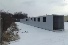 Container covered walkway in snow