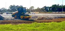 A padfoot roller compacting soil on a construction site, preparing the ground for stable infrastructure development.