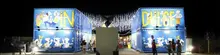 Row of uniquely designed shipping container kiosks, showcasing creative and functional modular retail solutions."