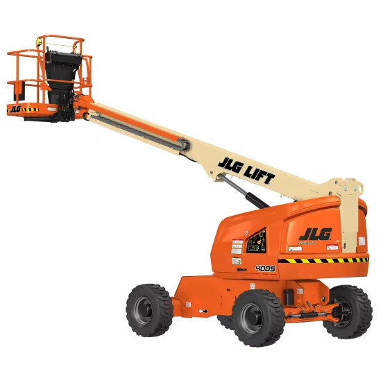 Rear angled view of an orange and beige JLG telescopic boom lift with extended boom and platform.