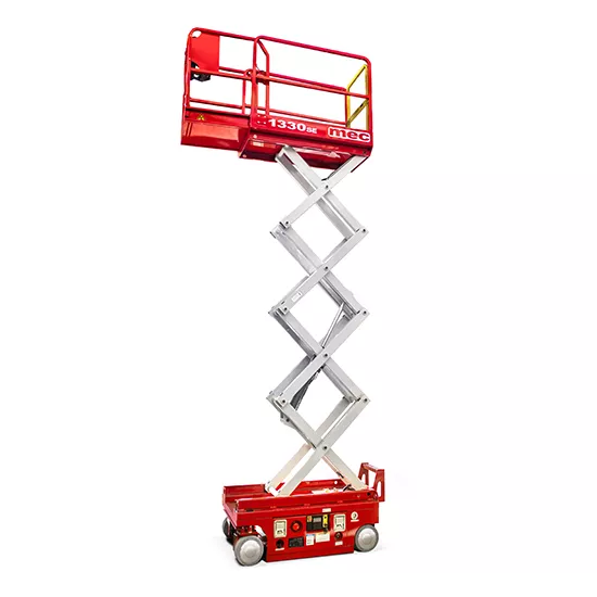 Side view of a red and silver scissor lift extended vertically, with safety rails.